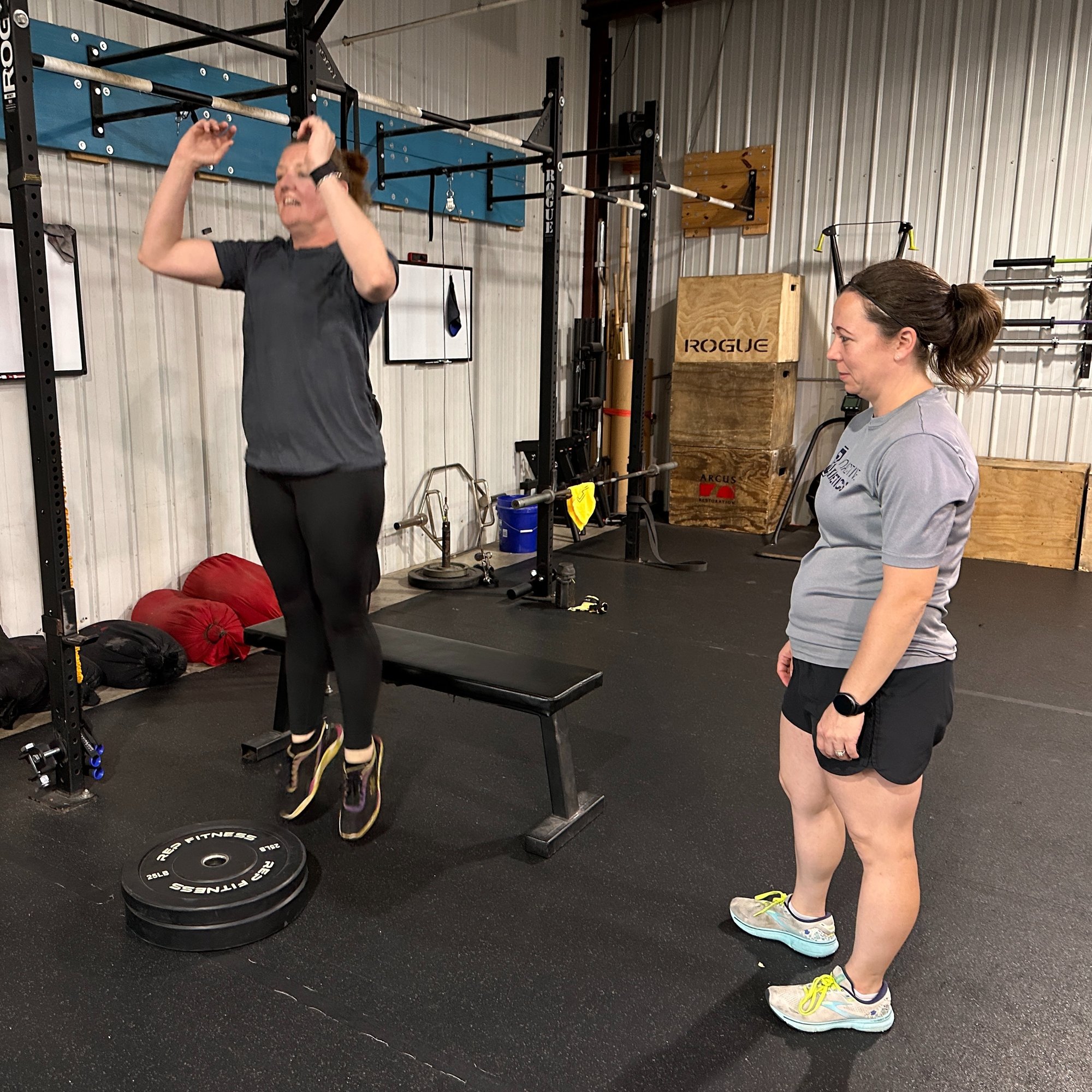 Dr. Sam watching client do jumping exercise
