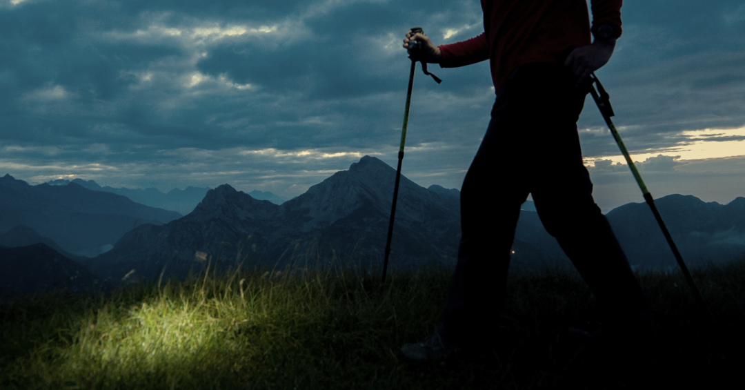 man hiking in the dark