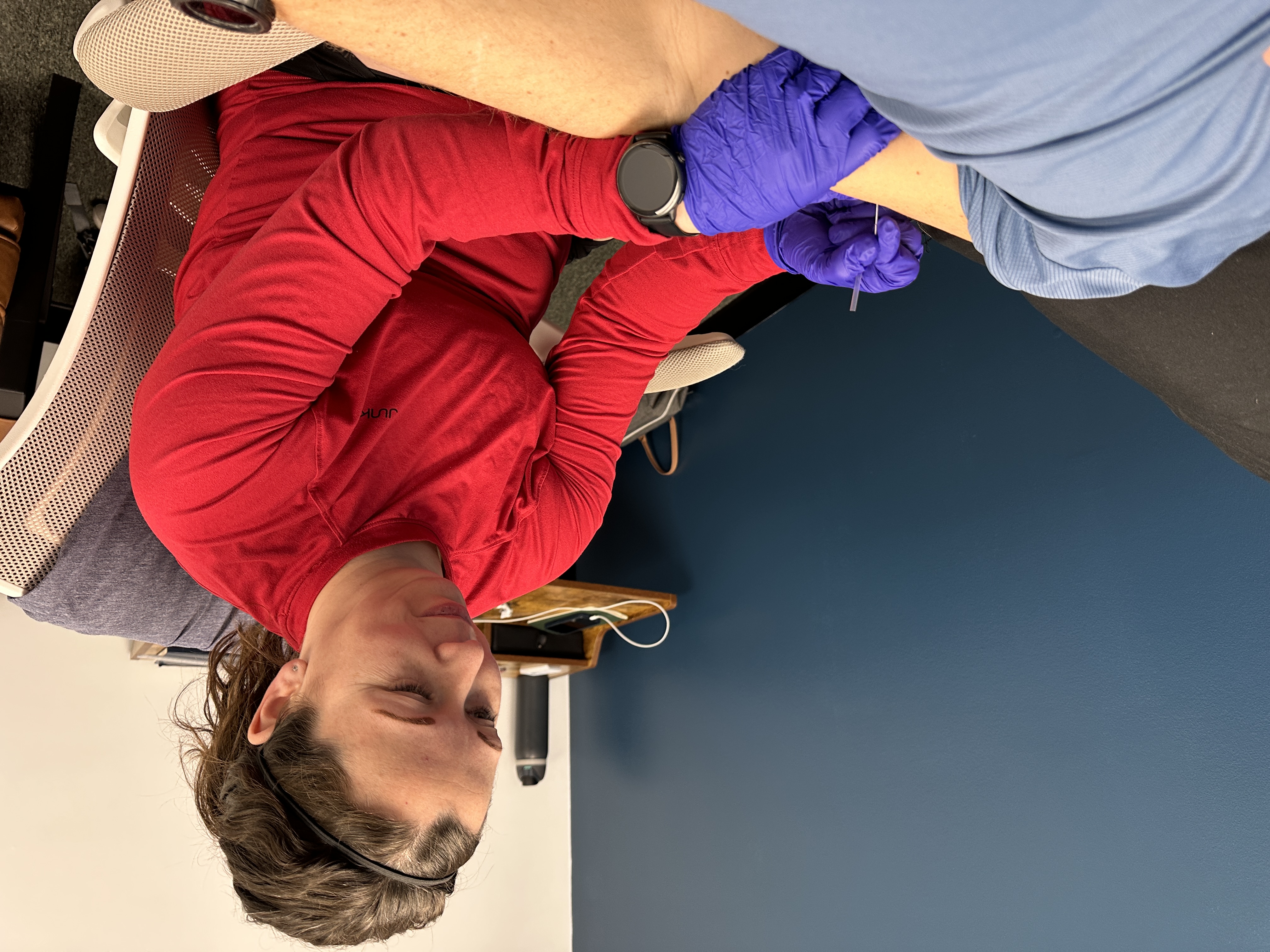 dr. sam dry needling client during 1-on-1 session